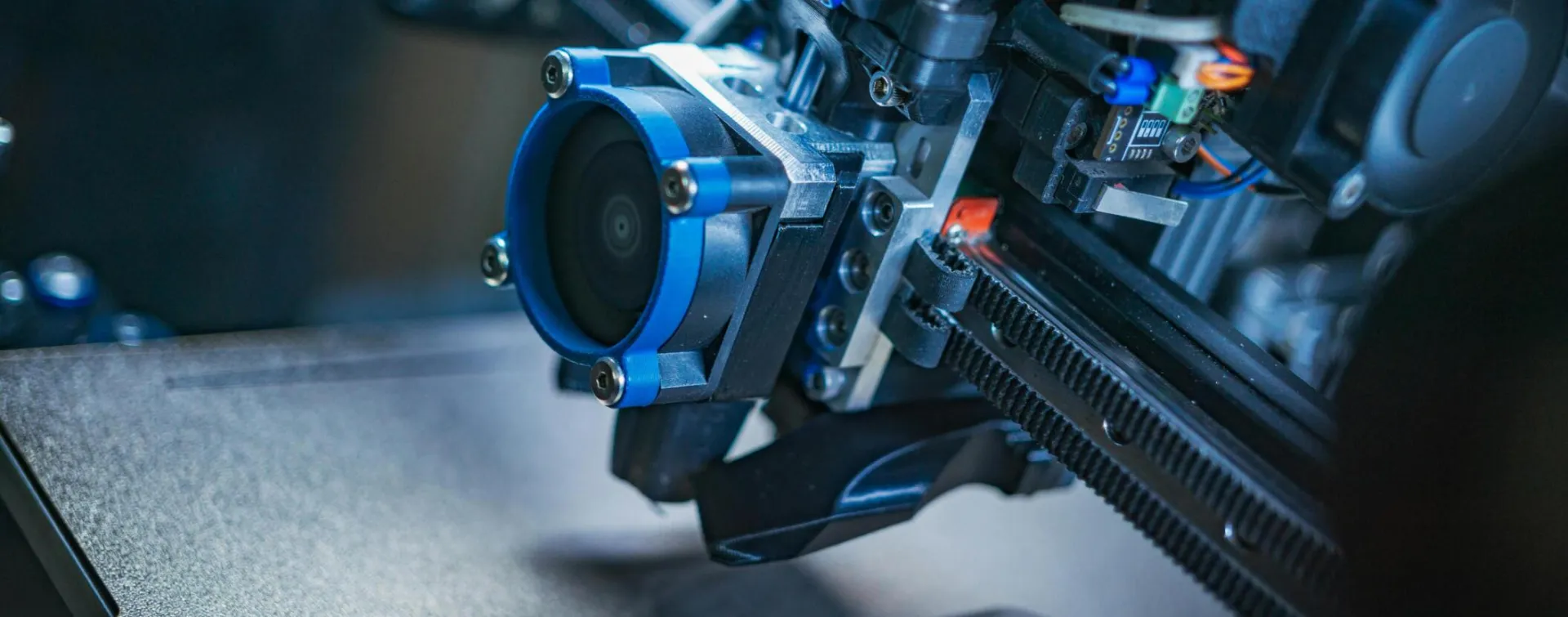 Detailed view of a high-tech 3D printer mechanism showcasing precision engineering.