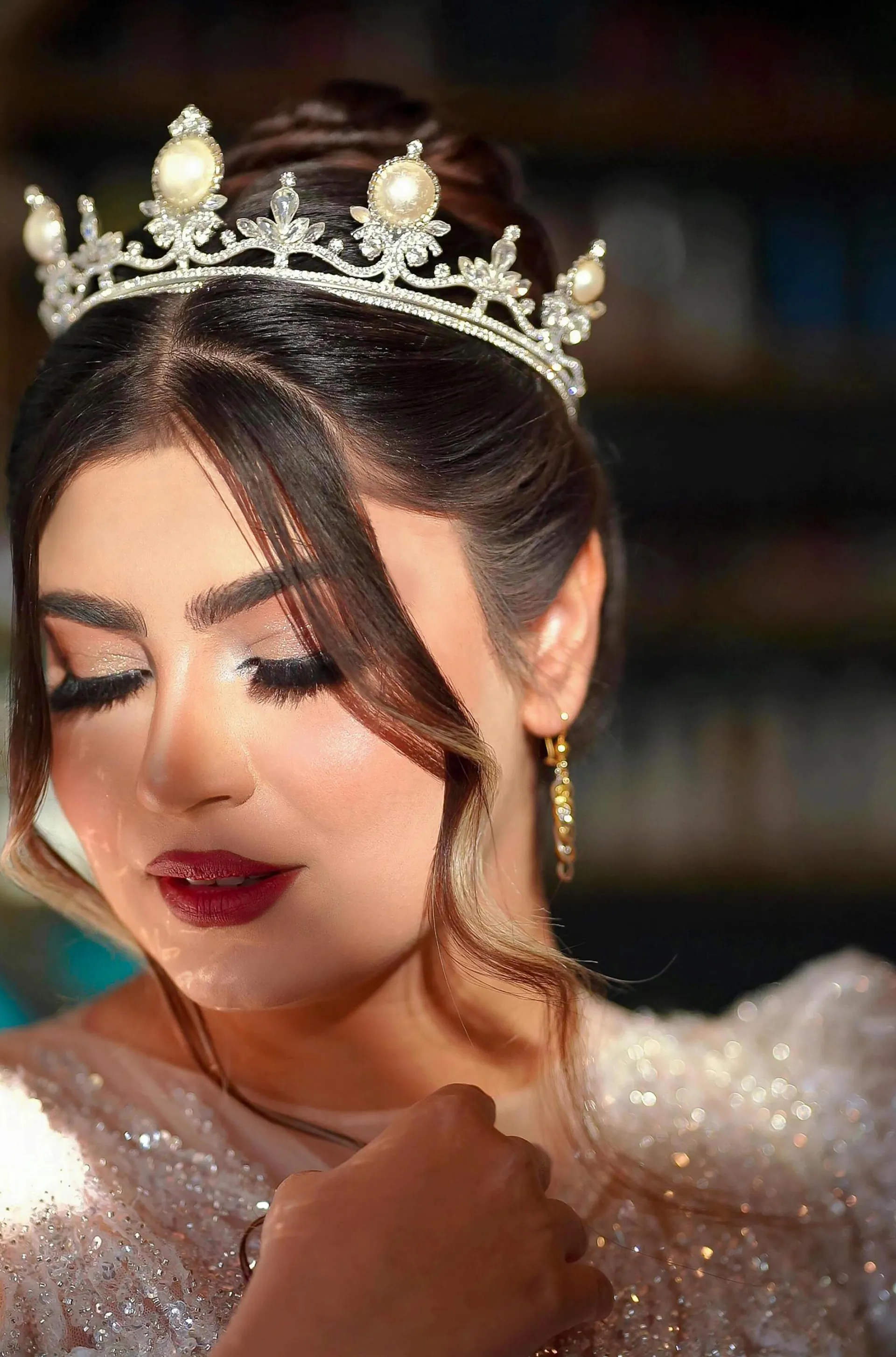 Captivating portrait of a woman with a pearl tiara and closed eyes, reflecting elegance and grace.