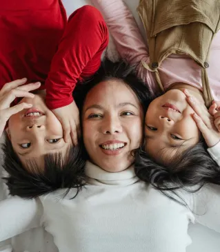 Caring moment between a senior man and a supportive woman at home, fostering connection and well-being.