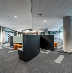 Spacious modern office interior featuring contemporary furniture and open workspace.