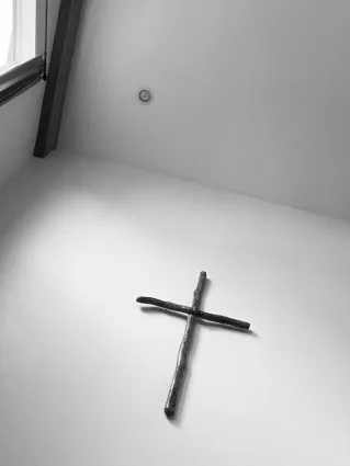The cross symbolizing the crucifixion of Jesus in the Christian faith.