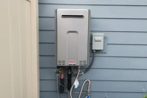 1 Tankless water heater mounted on side of wall. Picture to describe service for 1 tankless unit.