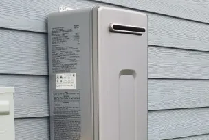 1 Tankless water heater mounted on side of wall. Picture to describe service for 3 tankless unit.
