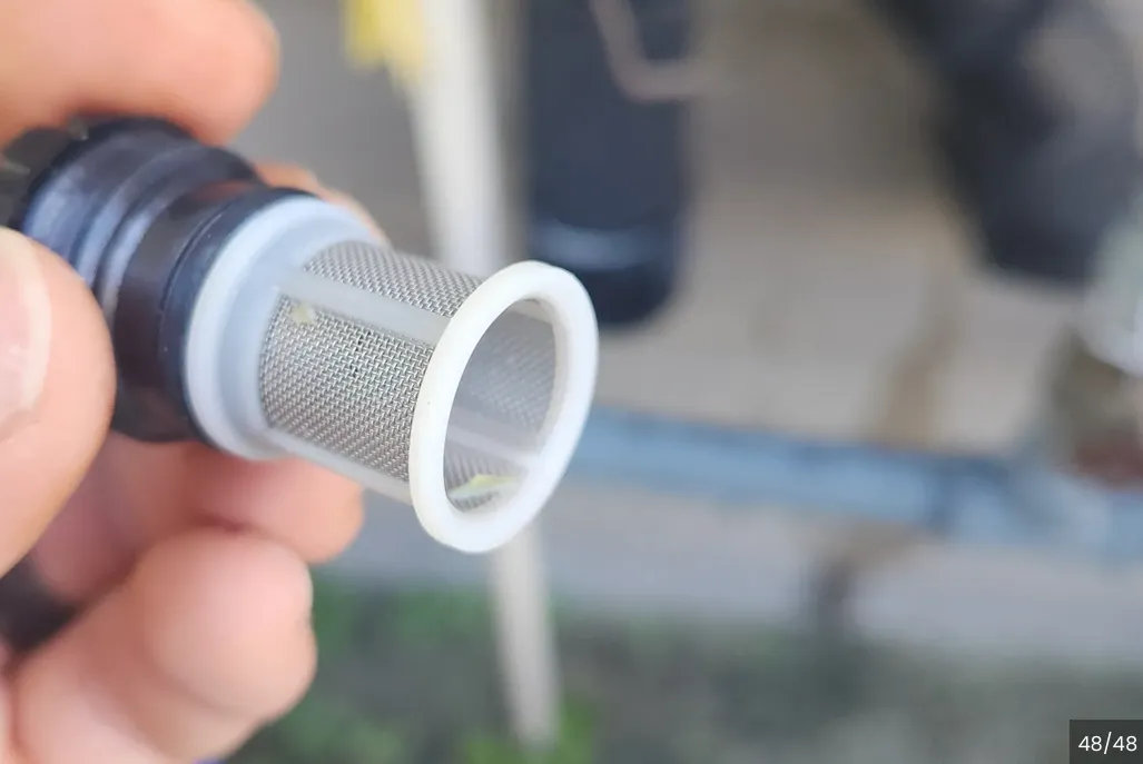 Wire Mesh and Plastic Inline Filter being displayed and held between fingers