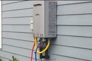 1 Tankless water heater mounted on side of wall. Picture to describe service for 4 tankless units.