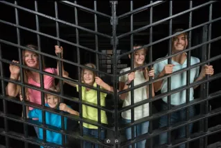 Visitors inside Old Jail Museum in St. Augustine, Florida