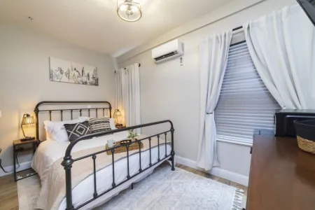 Cozy Hierro guest room with queen bed at Casa de Teo Boutique Inn in St. Augustine