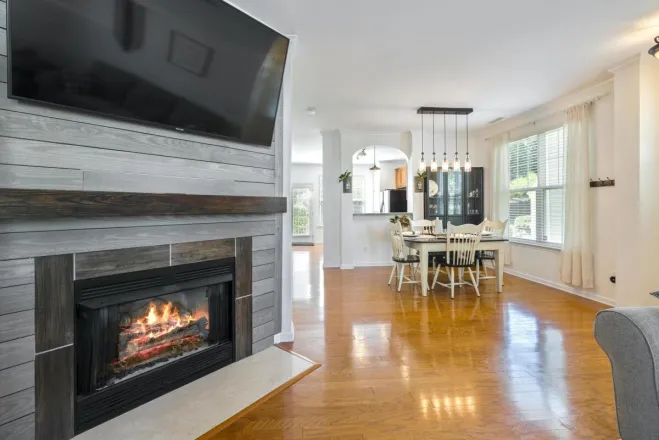 Elegant interior design featuring a cozy fireplace and modern dining area.