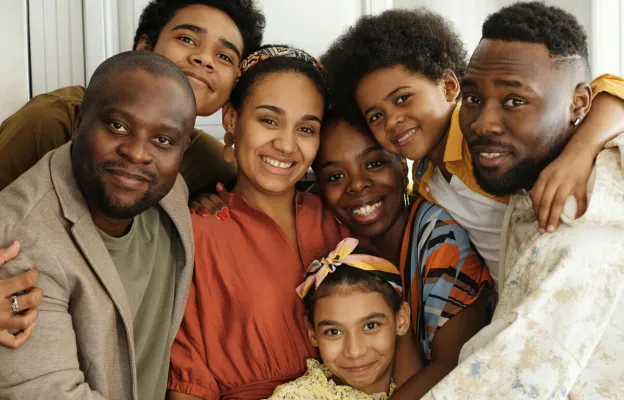 Happy family gathering in a cozy kitchen, celebrating with joy and love.