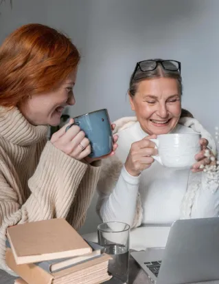 A heartwarming moment of a mother and daughter sharing coffee at home, radiating warmth and togetherness.
