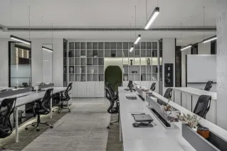 Explore this modern luxury office interior with open workspaces and sleek minimalist design.