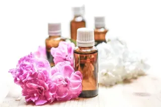 A serene spa setting with a woman receiving an arm massage, promoting relaxation and wellness.