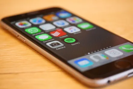 Close-up of a smartphone showcasing multiple app icons on its screen, representing modern technology and connectivity.