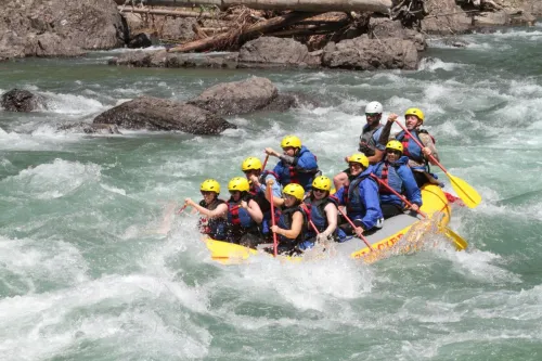 Group enjoying an exhilarating whitewater rafting adventure in Montana's rapids.