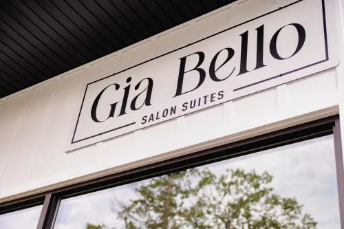 Cozy and stylish hair salon with modern decor and warm lighting, captured at night.