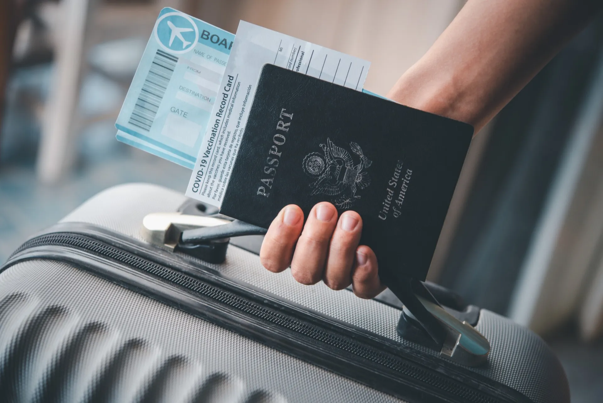 Close-up of US passport with inflight magazine and headphones on an airplane seat, ready for travel.