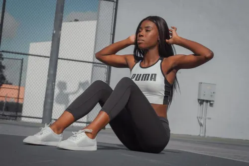 Athletic woman in sportswear exercising outdoors on a sunny day in Tampa, Florida.