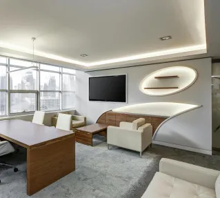 Sleek office space featuring contemporary furniture and city skyline views, ideal for professionals.