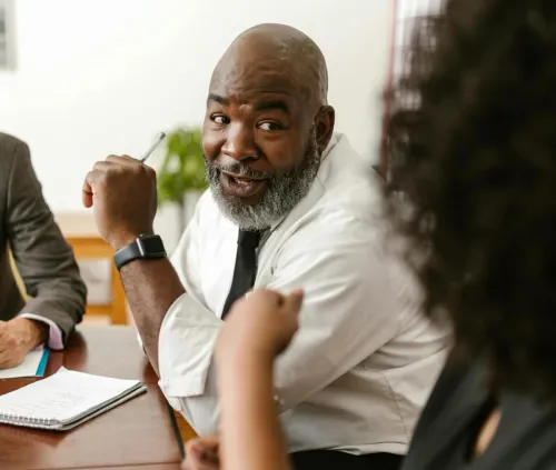 Diverse team discussing project strategies in a modern office setting.