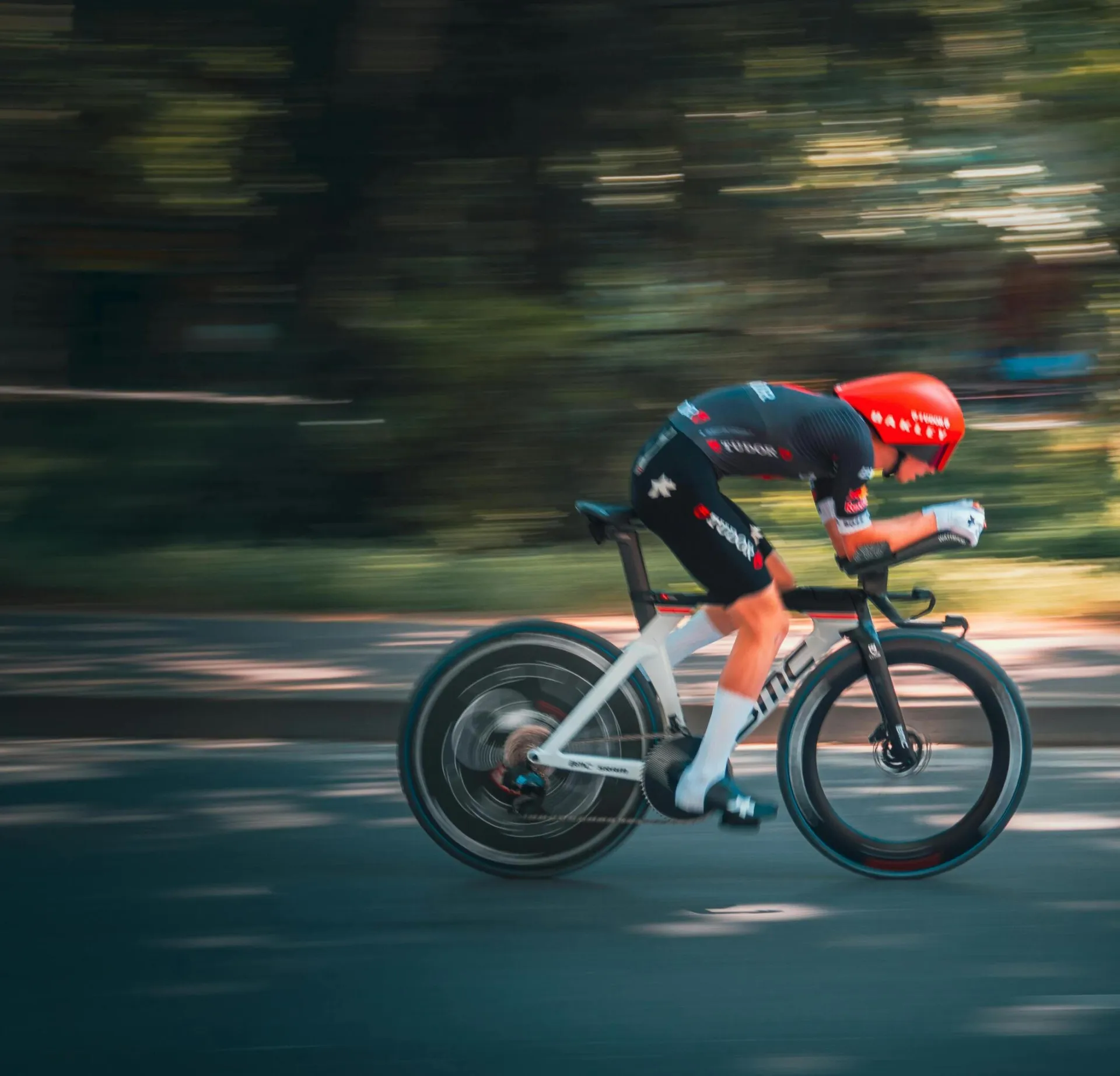 Dynamic shot of a cyclist racing on a sunny day in Tirana, capturing the essence of speed and agility.