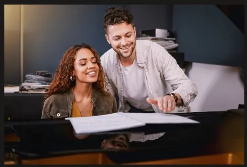 A joyful musician playing the keyboard in a music studio. Captures creativity and musical expression.