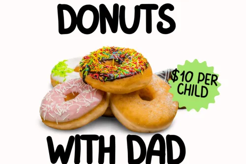A father and daughter share a bonding moment choosing donuts at an indoor supermarket.