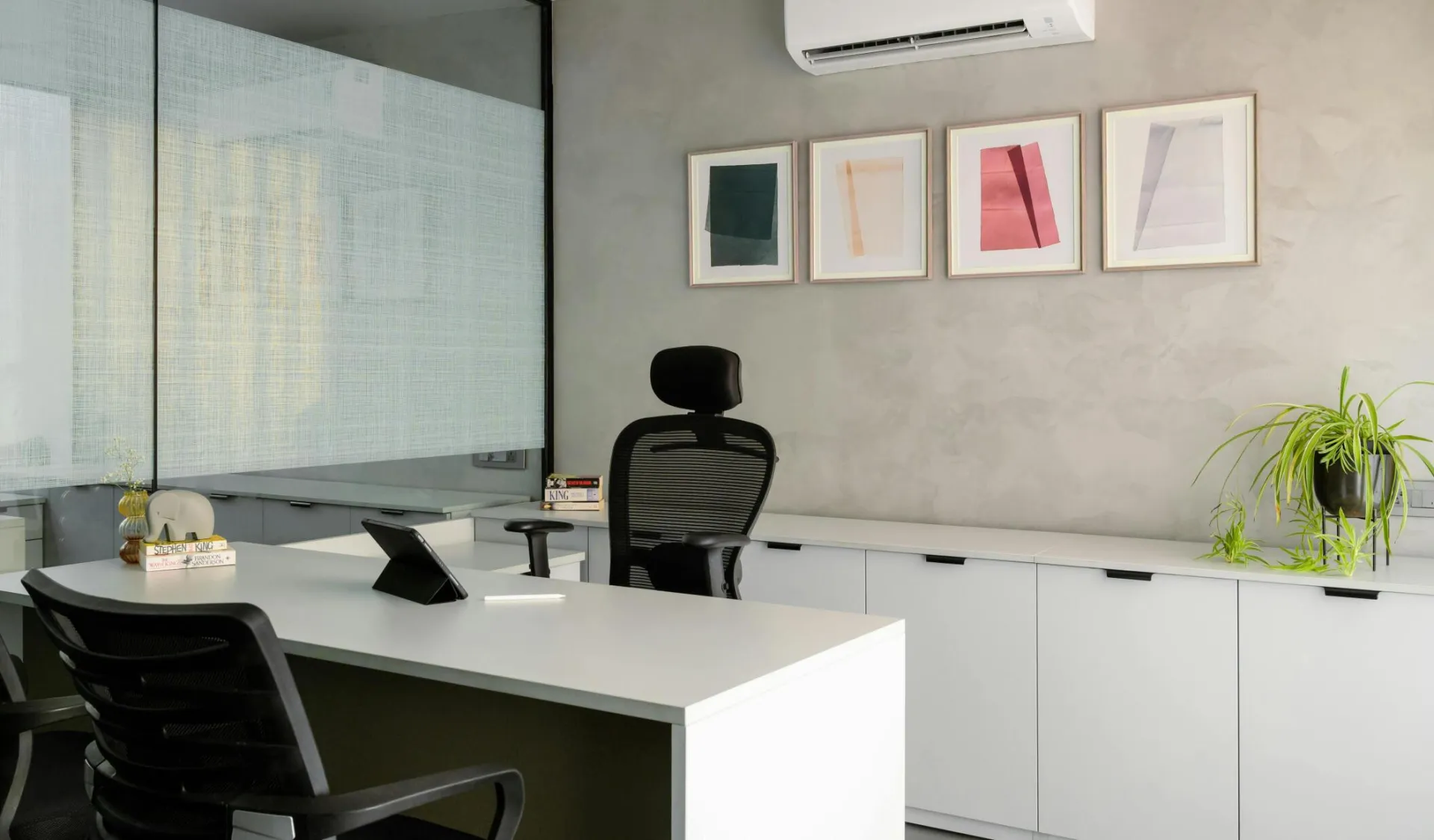 Contemporary office space with a sleek desk and modern decor, perfect for a professional setting.