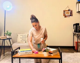 An HSH Personal Care Aide cleaning for a client