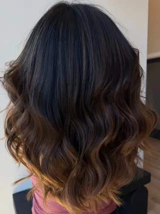 Close-up of vibrant hair coloring process with gloved hands applying dye.