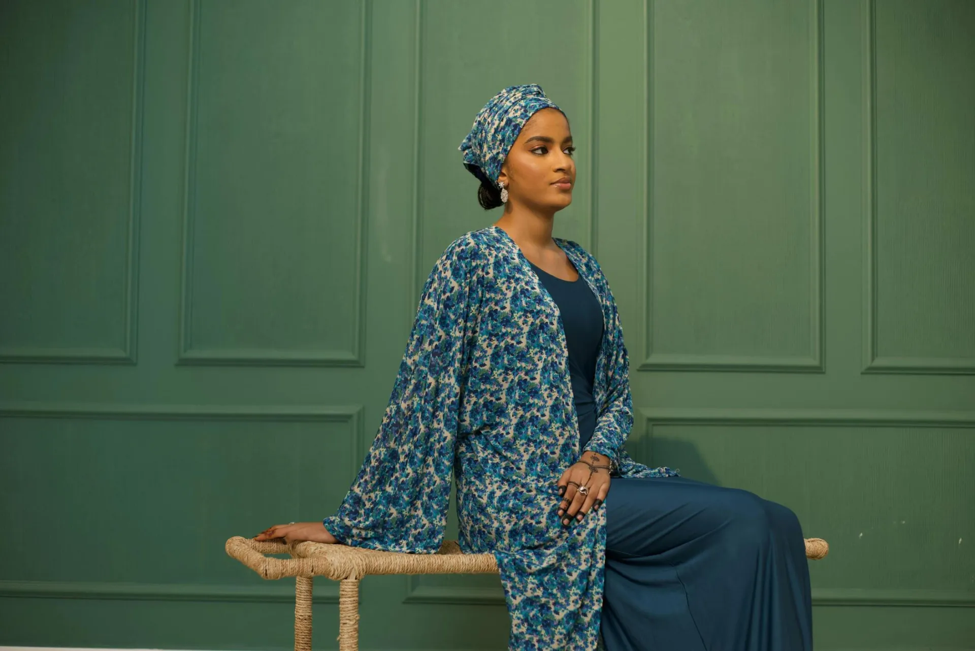 Elegant portrait of a woman in abaya with floral print in Nigeria.