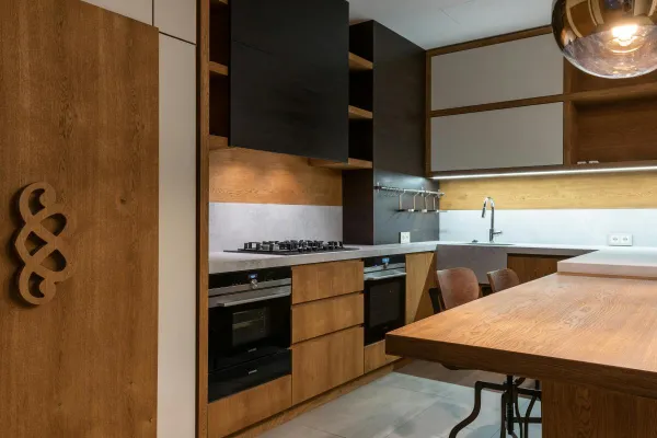 Stylish contemporary kitchen featuring wooden accents and modern appliances.