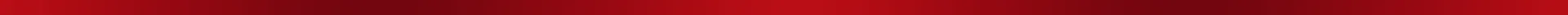 Close-up of a textured red surface with artistic brush strokes creating an abstract pattern.