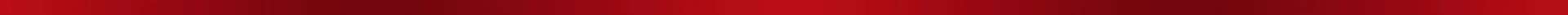 Close-up of a textured red surface with artistic brush strokes creating an abstract pattern.