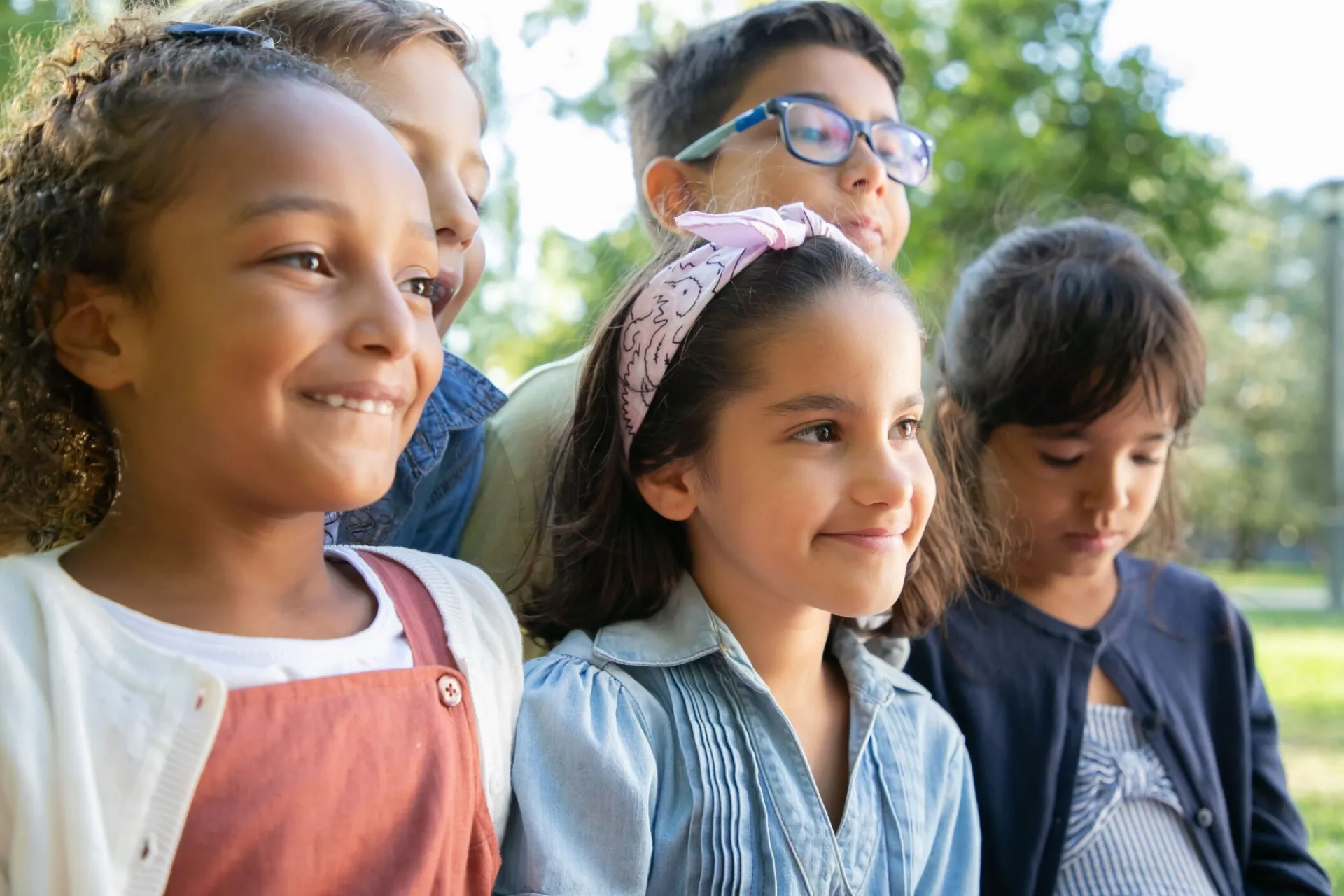 Cheerful group of diverse children enjoying a day outdoors in Portugal.