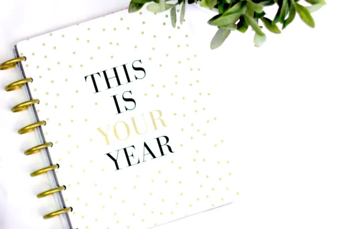 A stylish planner with motivational text and polka dot design, perfect for a fresh start.