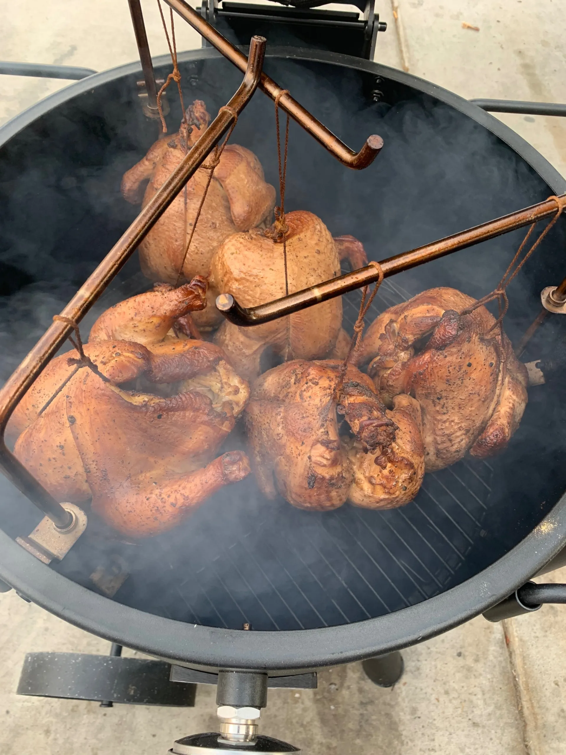 Tasty barbecue ribs sizzling on the grill, perfect for summer gatherings.
