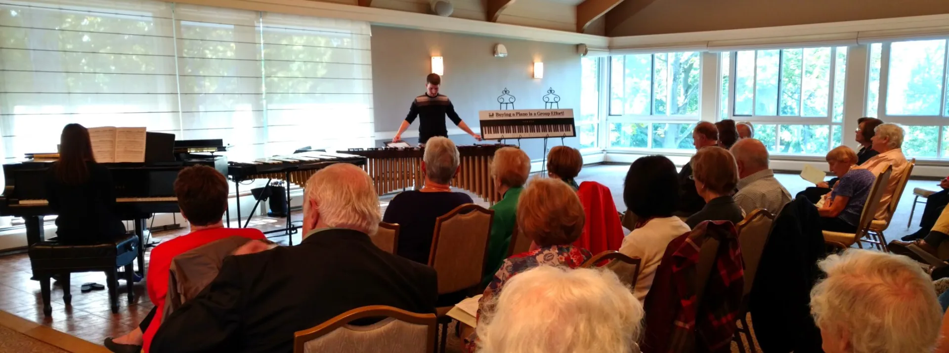 Close-up of hands playing a grand piano, highlighting elegance and skill.