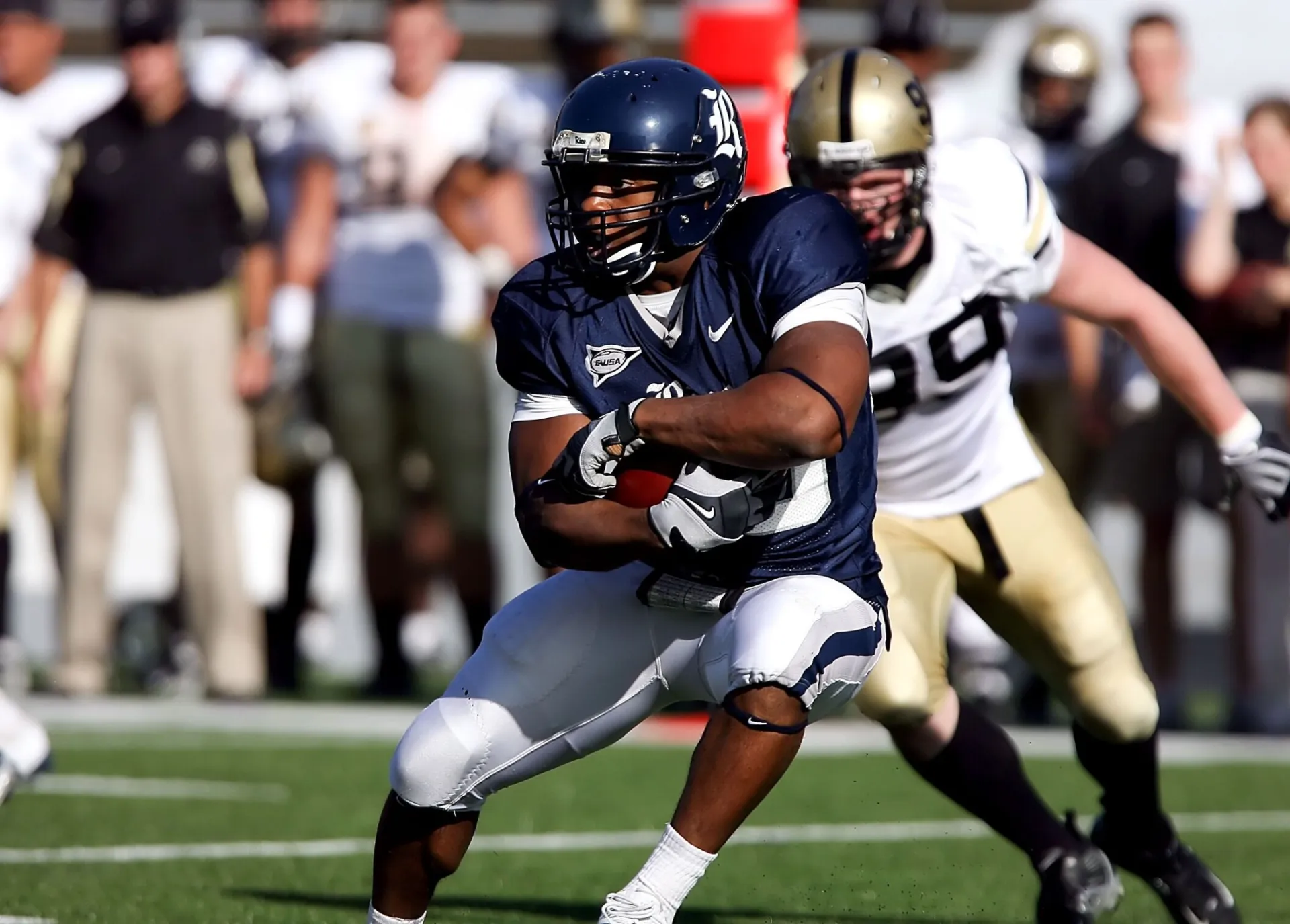 Intense moment captured during an American football game showcasing players in full action on the field.