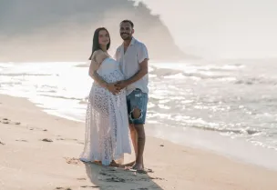 Couple enjoying a peaceful moment on a picturesque beach. Perfect for lifestyle and travel themes.