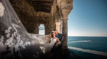 Beautiful wedding portrait of a couple by the sea in Portovenere, Italy.