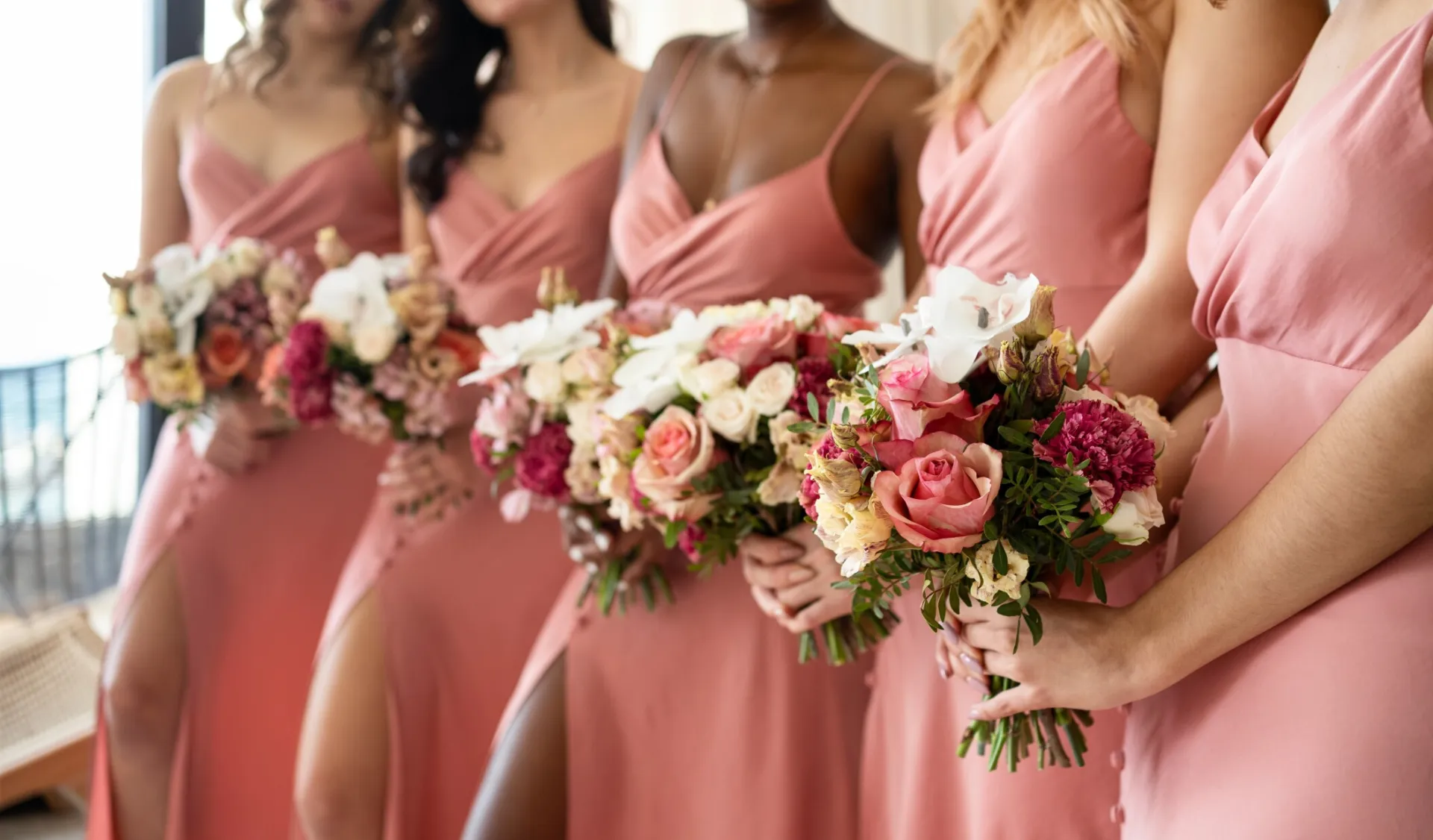 A newlywed couple shares a romantic moment in a beautifully decorated historic venue.