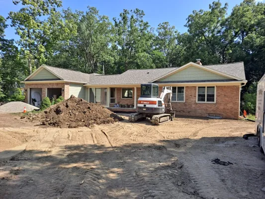 Grading the front yard to water flows away from the house and will not get into the basement