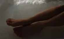 Person Lying on White Bed
